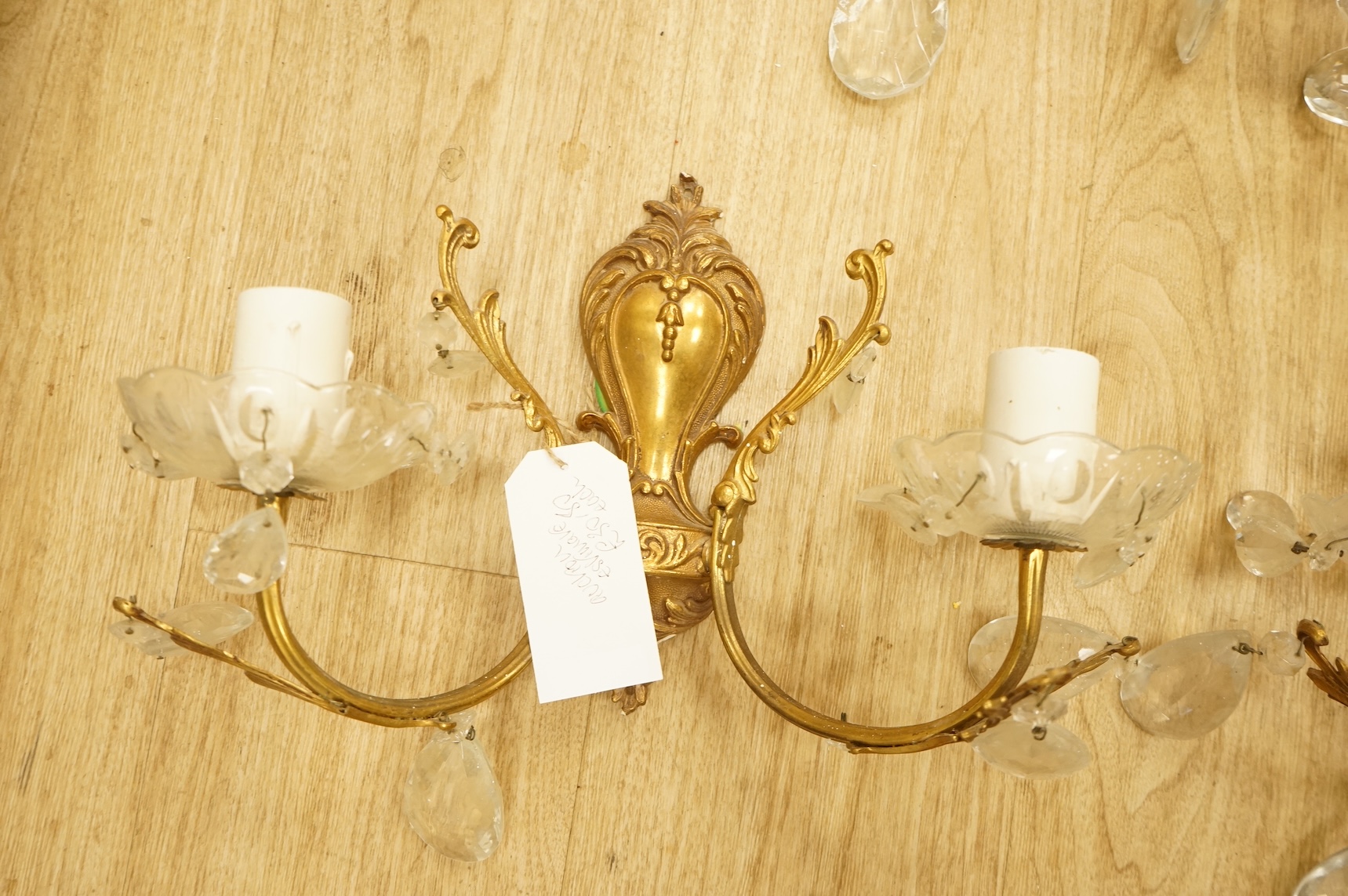 Five cast brass and glass wall lights